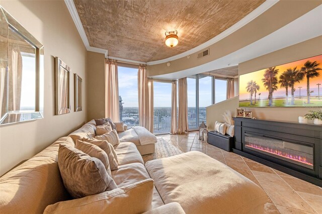 155 S Court Ave Unit 2710, Orlando, FL 32801 - tiled bedroom featuring crown molding, access to outside, and a glass covered fireplace