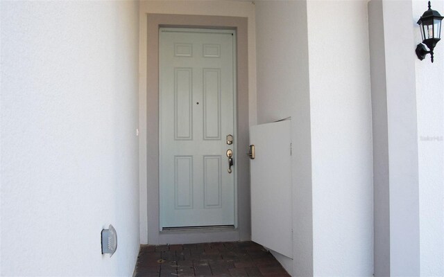 14569 Crestavista Dr, Clermont, FL 34714 - entrance to property featuring stucco siding