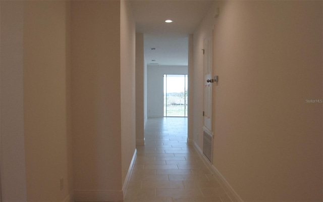 14569 Crestavista Dr, Clermont, FL 34714 - hallway featuring baseboards, recessed lighting, and light tile patterned flooring
