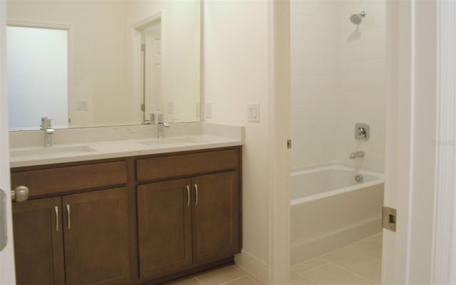 14569 Crestavista Dr, Clermont, FL 34714 - bathroom featuring double vanity, shower / bathtub combination, and tile patterned flooring