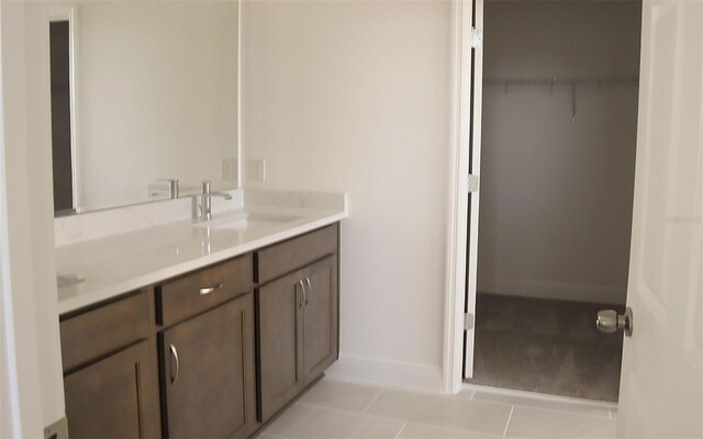 14569 Crestavista Dr, Clermont, FL 34714 - bathroom featuring vanity, baseboards, and tile patterned flooring