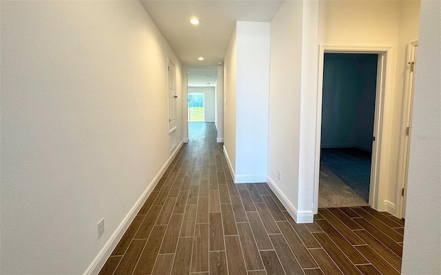 hall with recessed lighting, baseboards, and wood finish floors