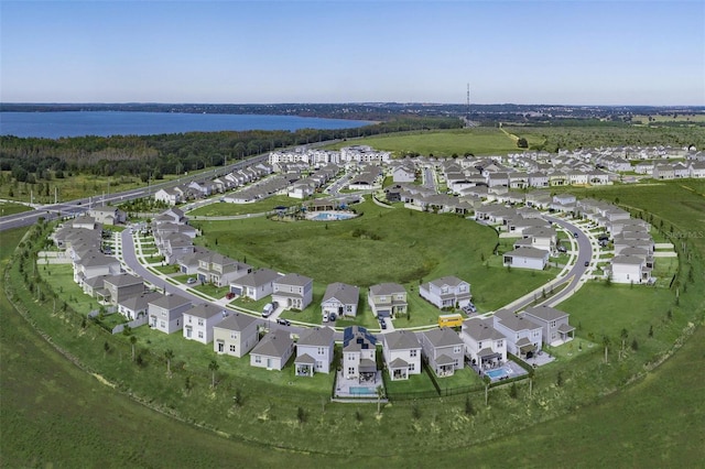 birds eye view of property with a residential view and a water view