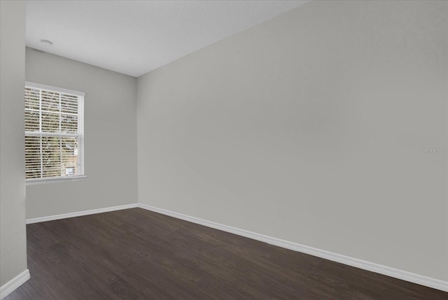 empty room featuring dark hardwood / wood-style floors