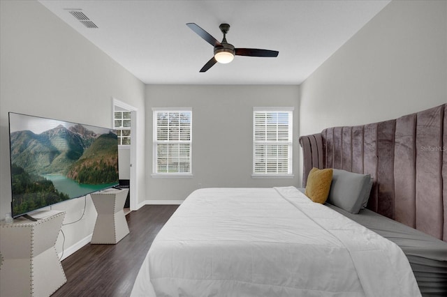 bedroom featuring ceiling fan and dark wood-type flooring