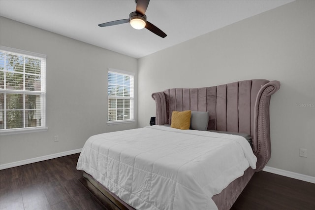 bedroom featuring ceiling fan and dark wood-type flooring