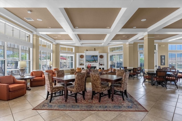 dining room featuring coffered ceiling, beamed ceiling, light tile patterned floors, and a healthy amount of sunlight