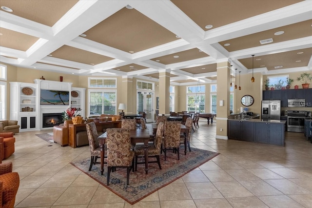 tiled dining area featuring coffered ceiling, ornamental molding, and beam ceiling