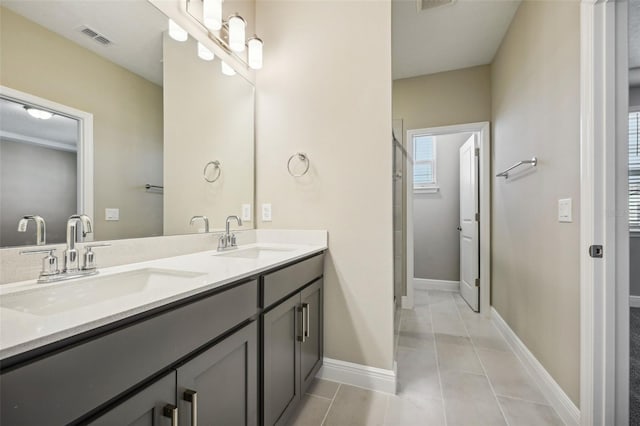 bathroom with vanity, tile patterned floors, and an enclosed shower