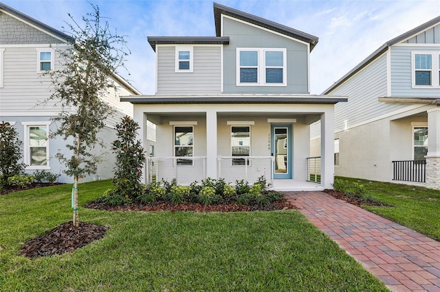 view of front facade with a porch and a front lawn