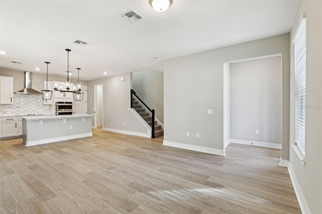 unfurnished living room with light wood-type flooring