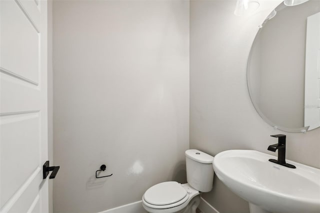 bathroom with sink and toilet