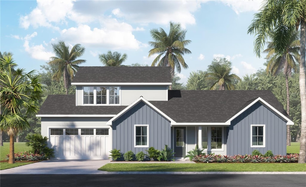 view of front of home featuring a garage and a front yard