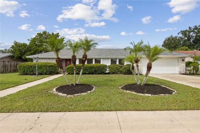 ranch-style house with a garage and a front lawn