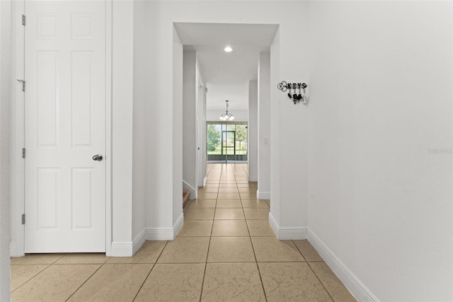 corridor featuring light tile patterned floors