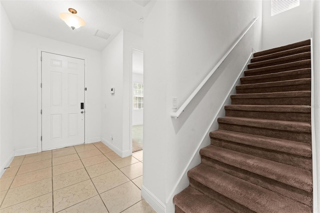 entrance foyer featuring light tile patterned floors