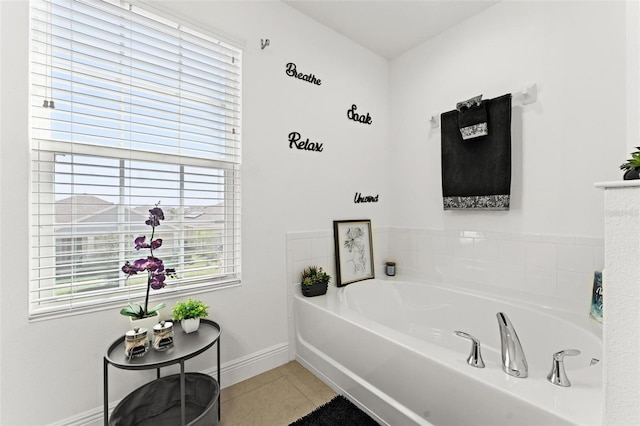 bathroom featuring tile patterned floors and a bathtub