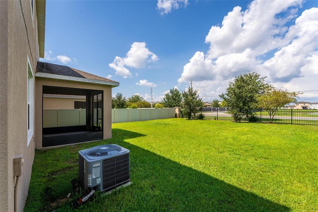 view of yard with central air condition unit