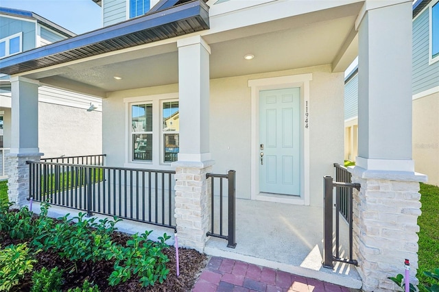 property entrance featuring covered porch