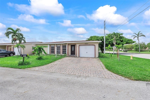 ranch-style house with a front lawn and a garage