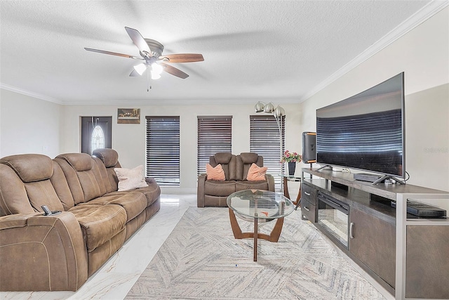 living room with ceiling fan, a textured ceiling, and crown molding