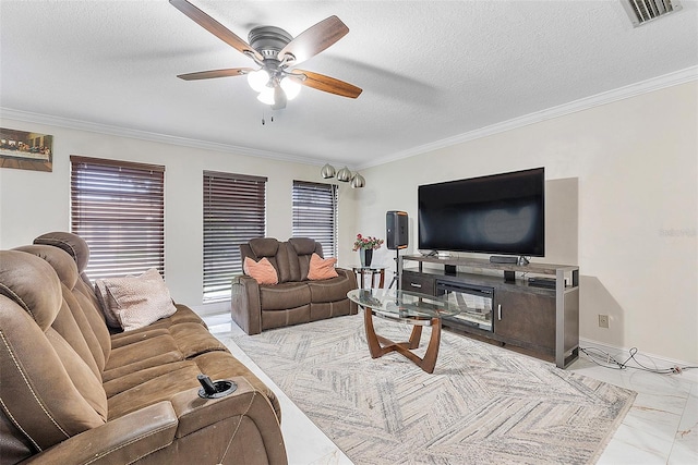 living room with ceiling fan, a textured ceiling, and ornamental molding