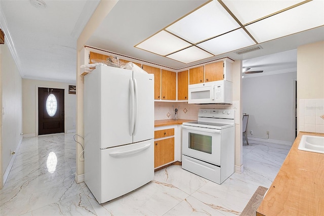 kitchen featuring ceiling fan, ornamental molding, tasteful backsplash, and white appliances