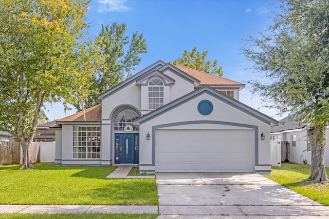 view of front of home featuring concrete driveway, an attached garage, stucco siding, and a front yard