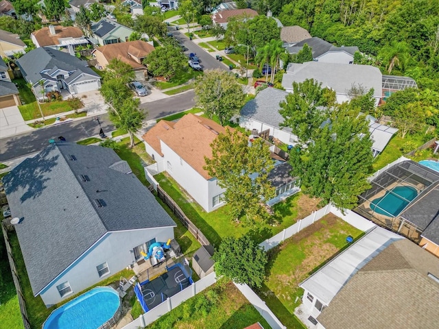 birds eye view of property with a residential view