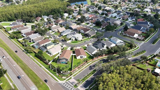 bird's eye view featuring a residential view and a water view