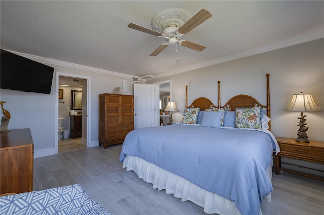 bedroom featuring connected bathroom, a textured ceiling, crown molding, ceiling fan, and hardwood / wood-style flooring