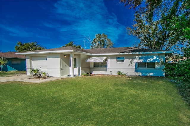 ranch-style house with a front lawn and a garage