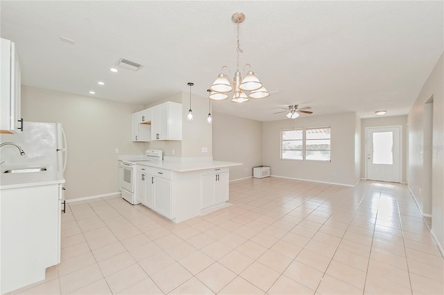 kitchen featuring white cabinets, white electric range oven, sink, and ceiling fan with notable chandelier