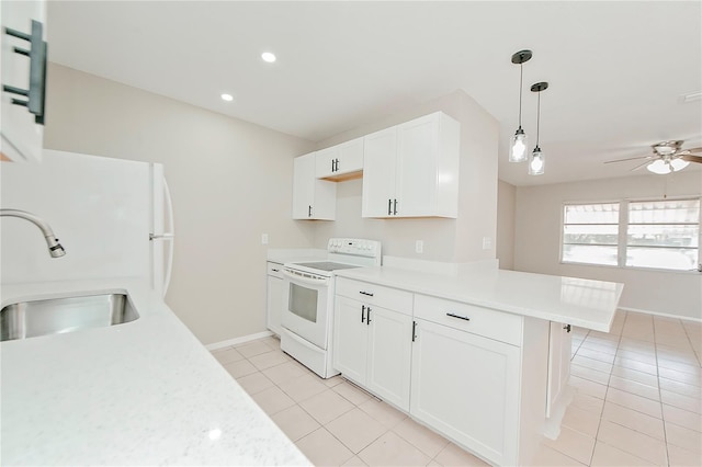 kitchen featuring white cabinets, sink, white electric stove, decorative light fixtures, and kitchen peninsula