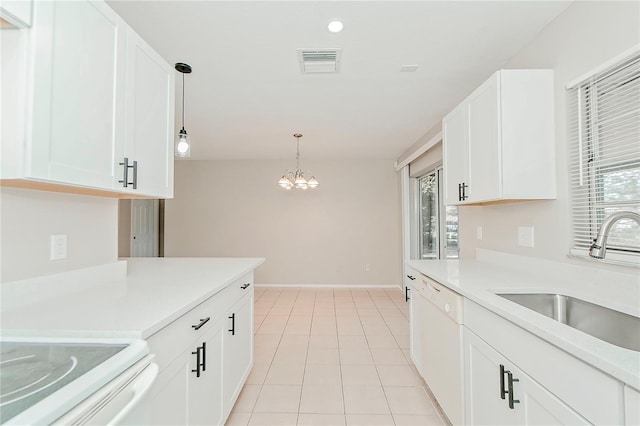 kitchen with white cabinets, dishwasher, sink, and a wealth of natural light