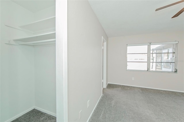 interior space featuring carpet floors, a closet, and ceiling fan