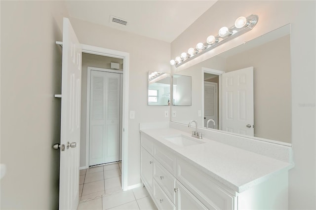 bathroom featuring tile patterned floors and vanity