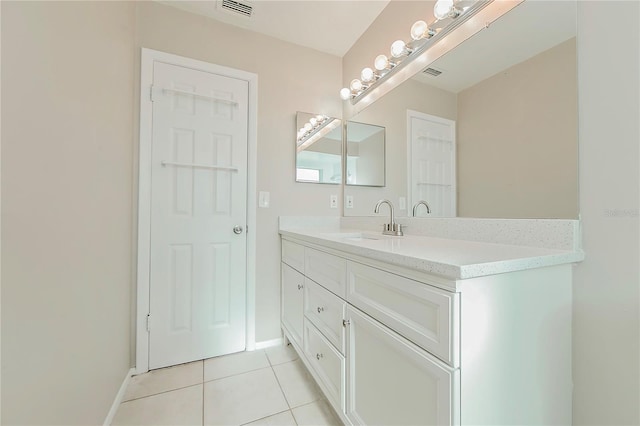 bathroom featuring tile patterned flooring and vanity