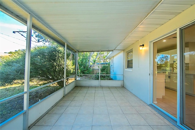 unfurnished sunroom featuring a healthy amount of sunlight