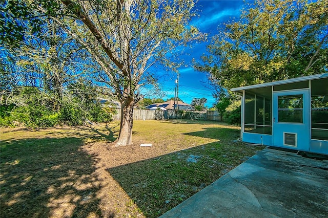 view of yard with a patio and a sunroom