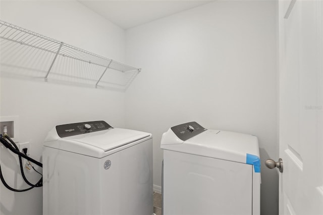 laundry area with washing machine and clothes dryer