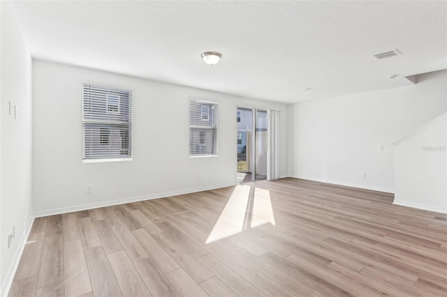 unfurnished room featuring light hardwood / wood-style floors