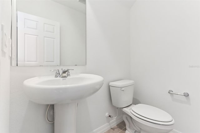 bathroom featuring toilet