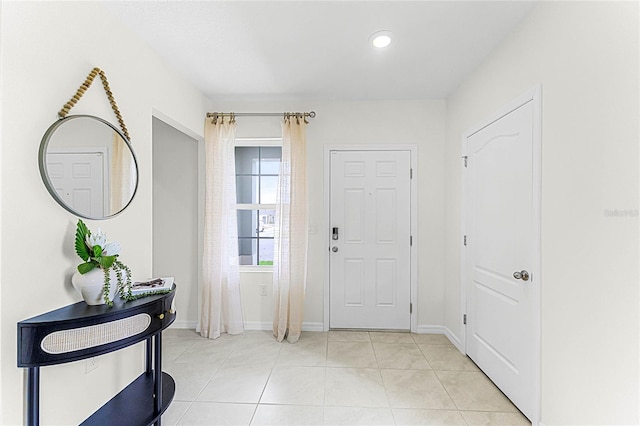 entrance foyer with light tile patterned floors