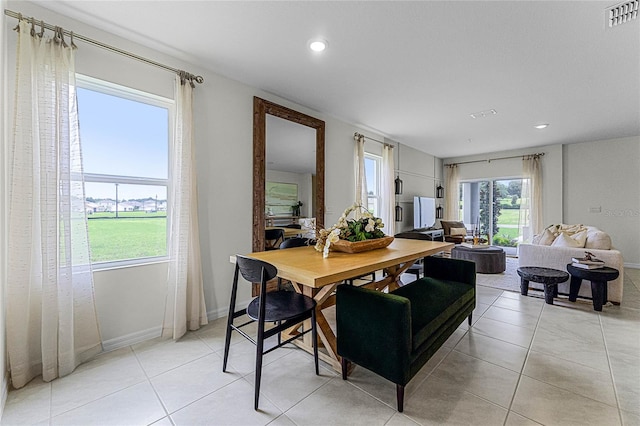 dining area featuring light tile patterned flooring