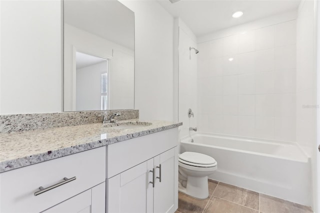 full bathroom with tile patterned floors, vanity, toilet, and tiled shower / bath combo