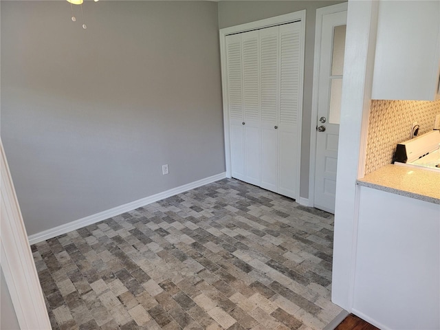 unfurnished bedroom featuring a closet