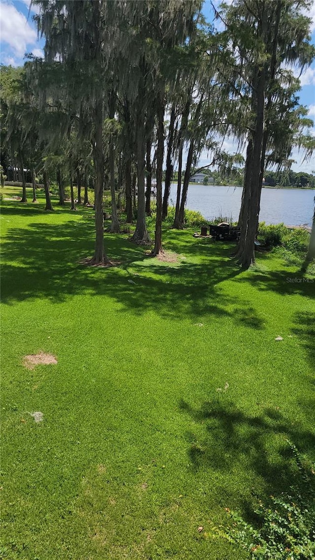 5625 Chipola Cir, Orlando, FL 32839 - view of grassy yard with a water view
