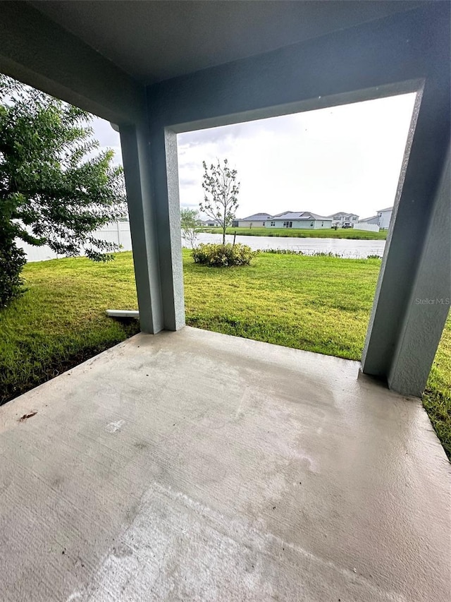 view of patio with a water view