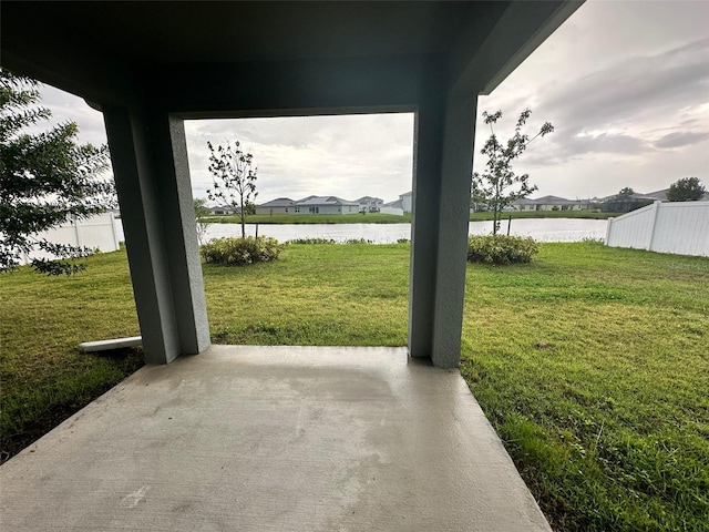 view of patio with a water view